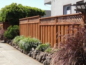 Beautiful finished all heart redwood privacy fence with a decorative lattice top